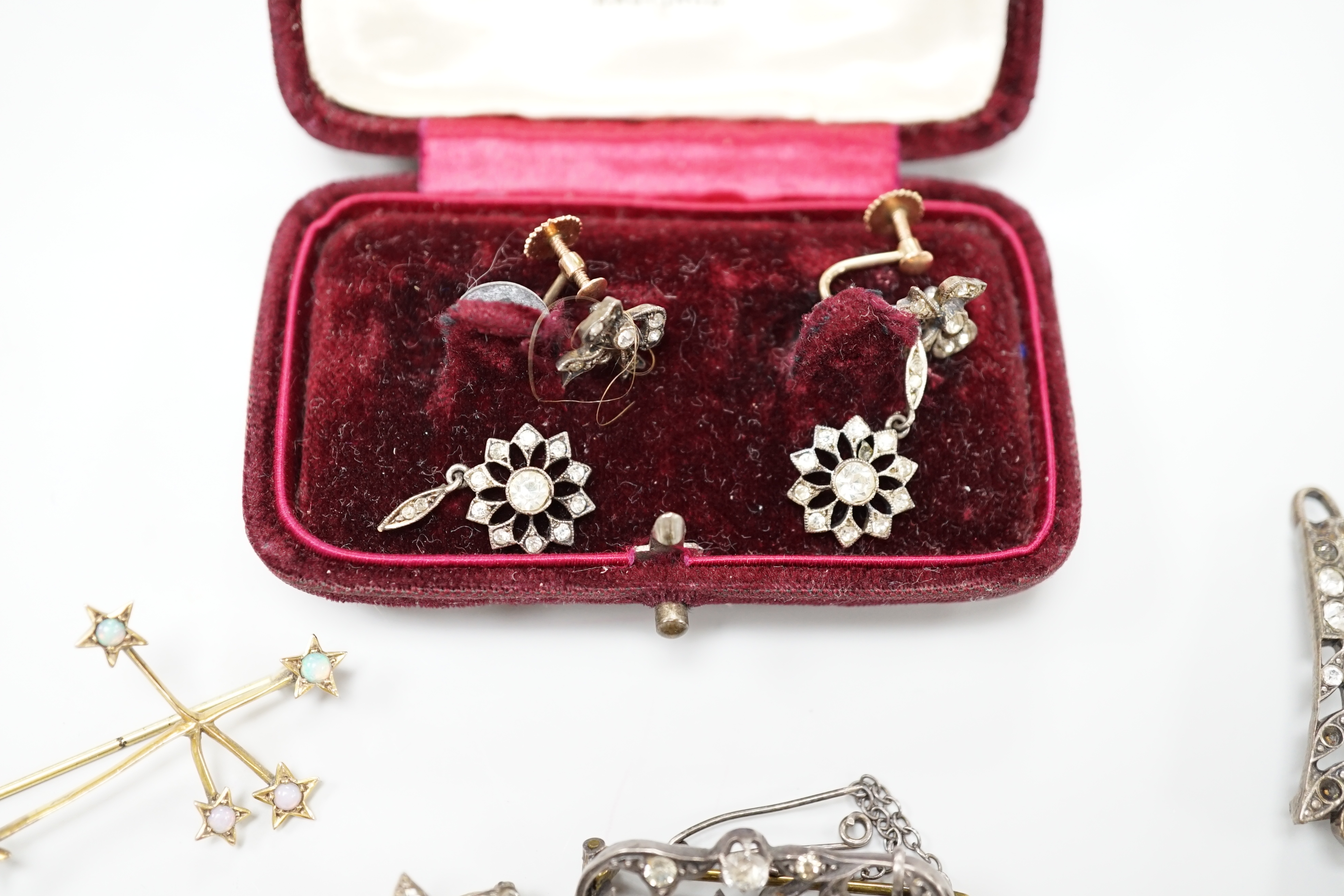 A group of mainly paste set jewellery including a pair of 9ct gold, silver and paste drop earrings and an opal set constellation brooch